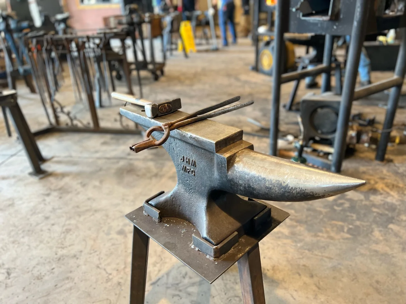 Decorative forged metalwork resting on an anvil